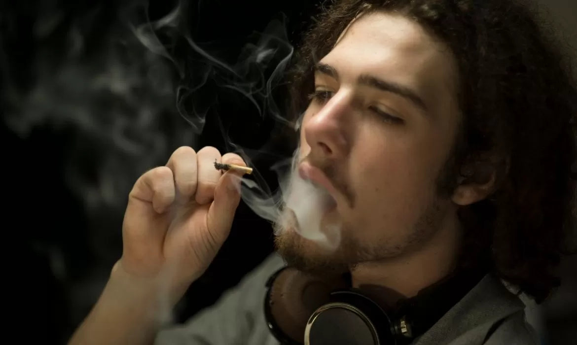 Man smoking one of the best strains for creativity and focus