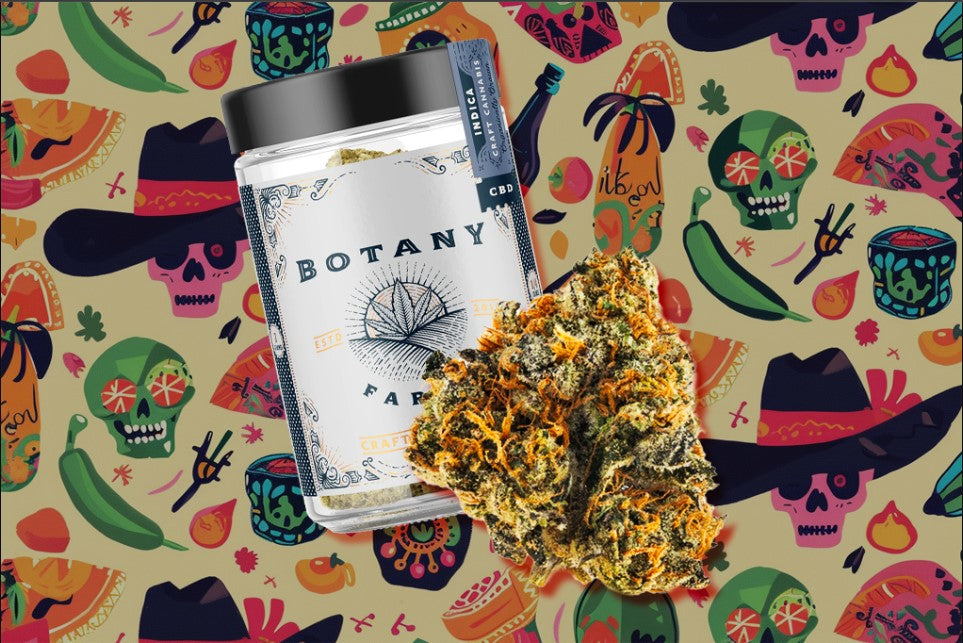 A container of Botany Farms Craft Cannabis CBD with Indica flavor, along with a cannabis strain, against a multicolored background