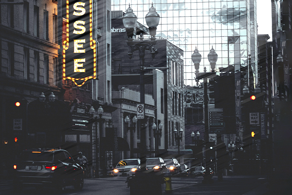 Exterior view of Tennessee Theatre with cars on the road in front