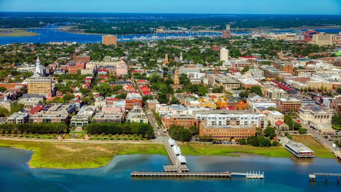 An aerial photo of Charleston South Carolina, the blue water glistening in the sunlight