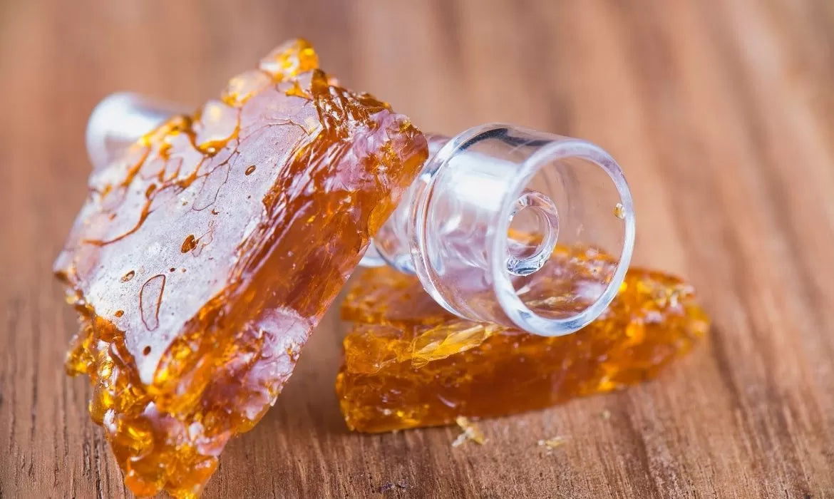 Cannabis shatter with a glass dabbing tool