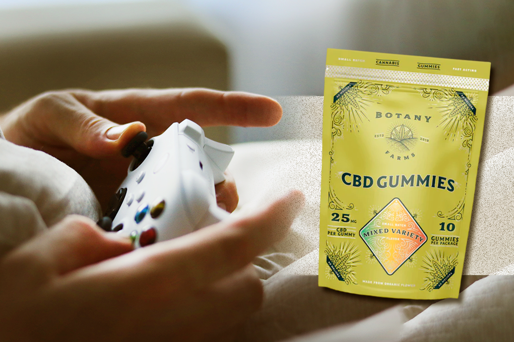 On the left side of the image, a hand is controlling a joystick, while on the right side, there is a yellow pack of Botany Farms CBD Gummies with mixed variety flavors