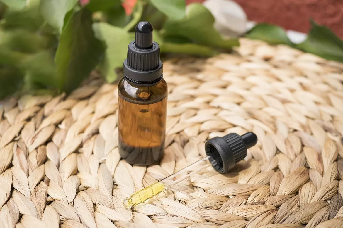 CBD Oil and dropper sitting on a mat